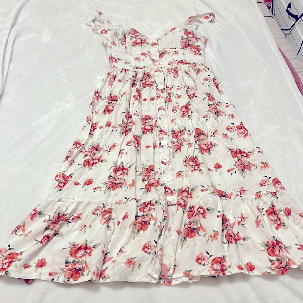 Long white floral dress, adjustable button straps with a built in bra.
